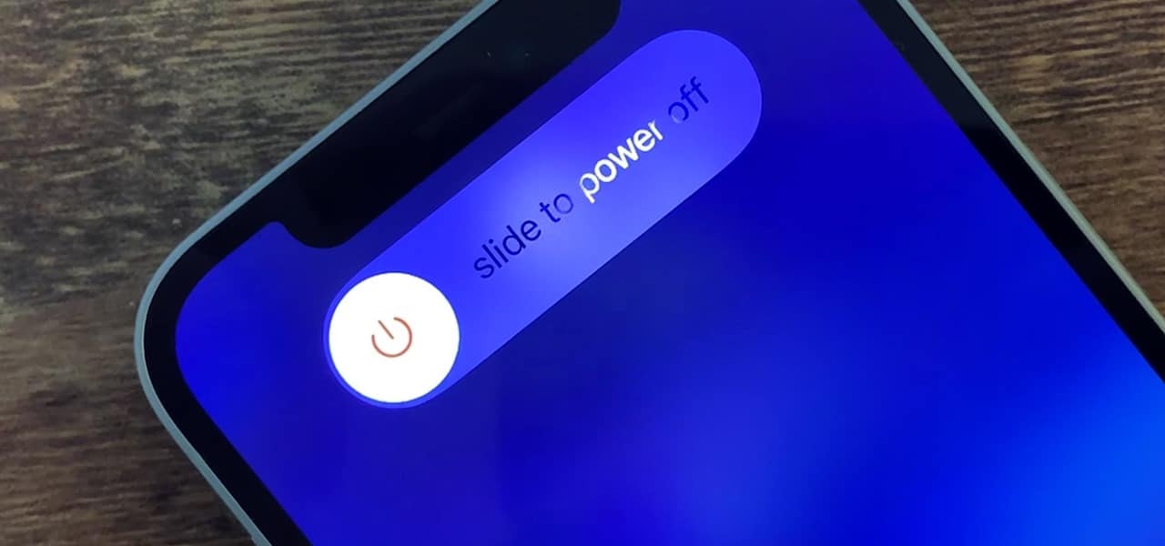 A screenshot of the iOS power-off slider on an iPhone, showing a power icon and the words "slide to power off".