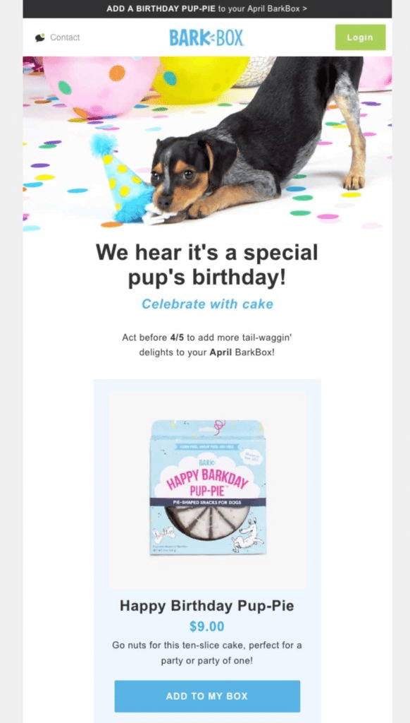 Esempio di un’email di "buon compleanno" da BarkBox con la foto di una cane che morde un cappellino da festa