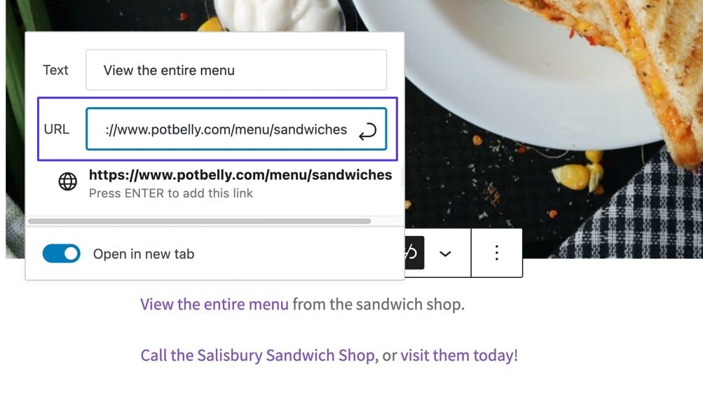 Schermata di un post WordPress dove in primo piano c’è il menu Gutenberg per l’inserimento di un URL e l’indirizzo del sito potbelly.com