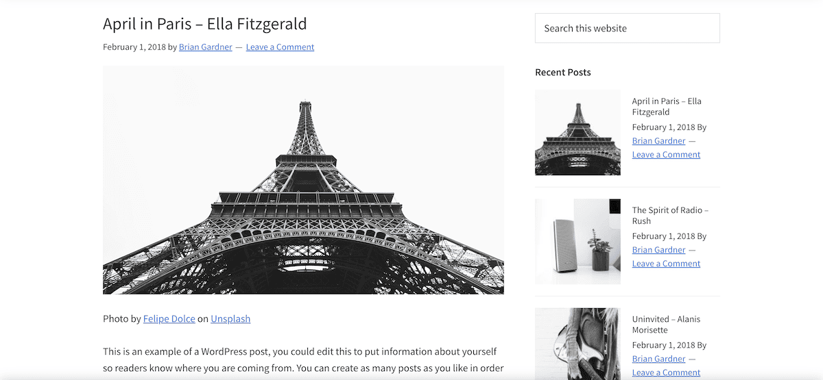 Una página de entrada de blog que utiliza el framework Genesis. Presenta una imagen en blanco y negro de la Torre Eiffel de París. La entrada se titula Abril en París — Ella Fitzgerald y está fechada el 1 de febrero de 2018. La barra lateral muestra entradas recientes con imágenes en miniatura.