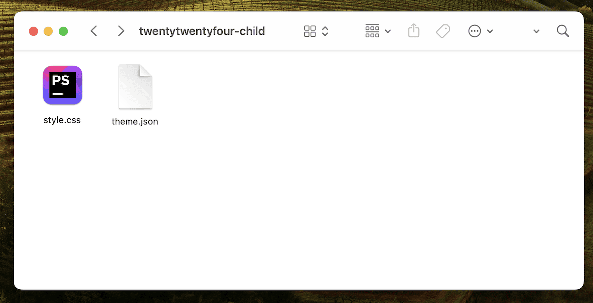 Uma janela do explorador de arquivos do macOS para o tema **twentytwentyfour-child** exibindo dois arquivos: **style.css** e **theme.json**, indicando a configuração de um tema filho para desenvolvimento no WordPress.