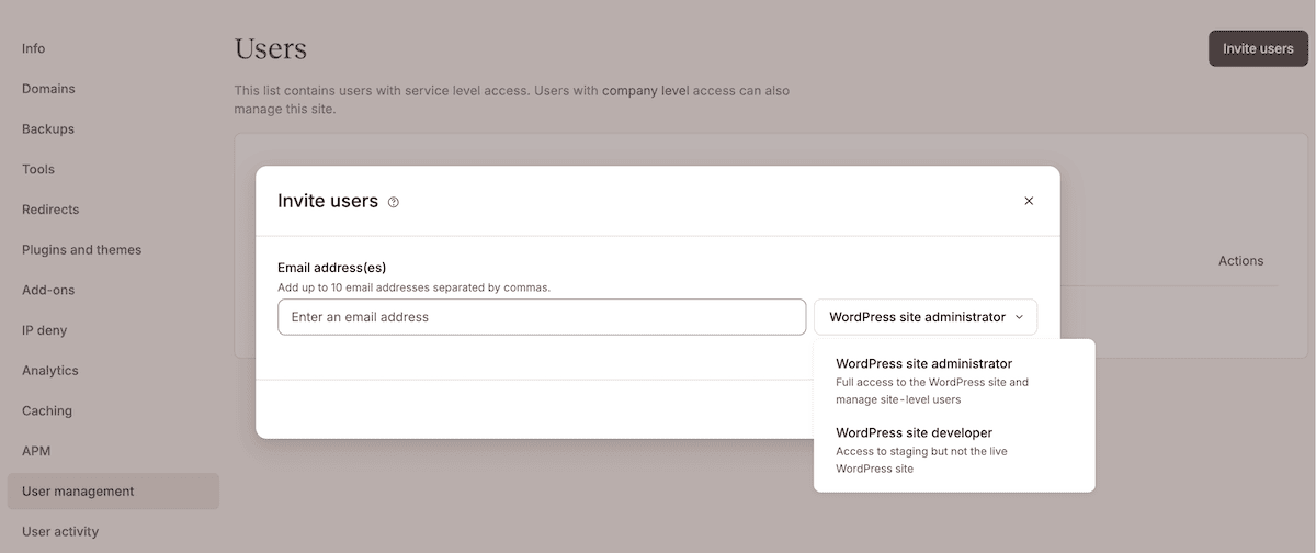 MyKinsta's Users management interface showing an Invite users modal window. The modal lets you add up to ten email addresses and select user roles, with options for WordPress site administrator or WordPress site developer. The interface includes a close button and explains that the list contains users with service level access.