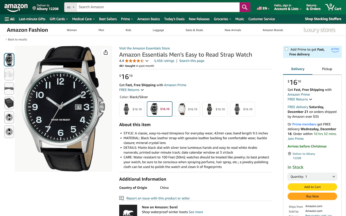 An Amazon product page featuring an Amazon Essentials Men's Easy to Read Strap Watch. The page shows delivery options to Albany 12208.