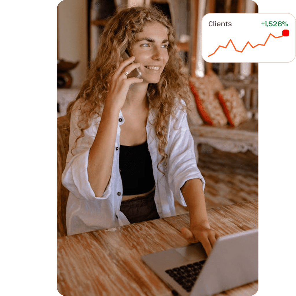 Agency partner on talking on phone while working on laptop
