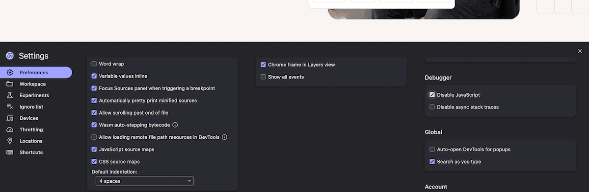 The browser DevTools open showing the Disable JavaScript setting checked under the Debugger panel.